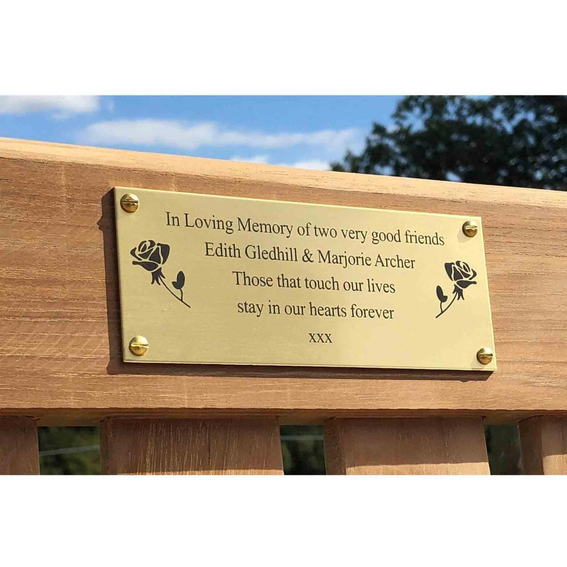 commemorative bench displaying a brass plaque