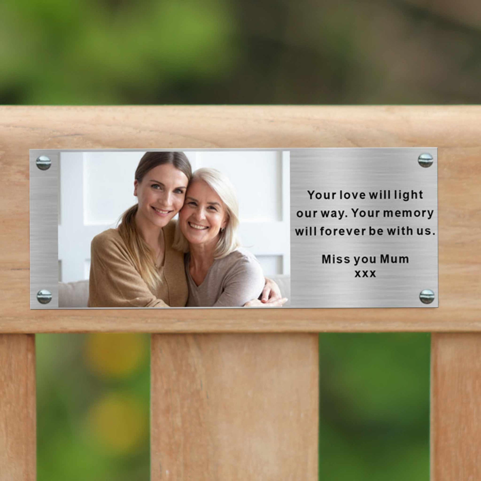 commemorative bench displaying a photo plaque