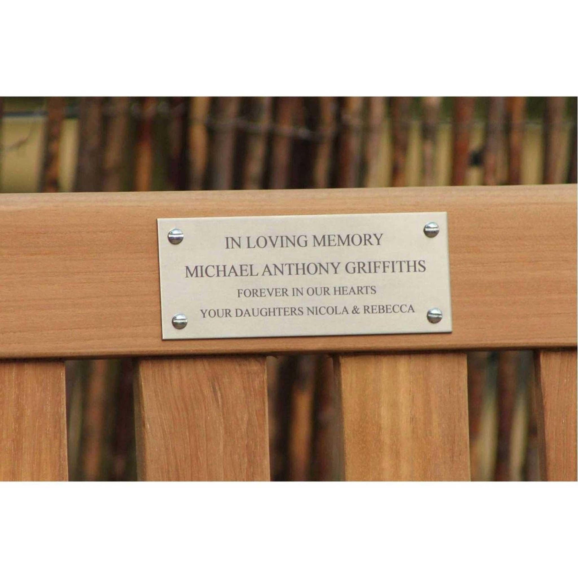 commemorative bench displaying a stainless steel plaque