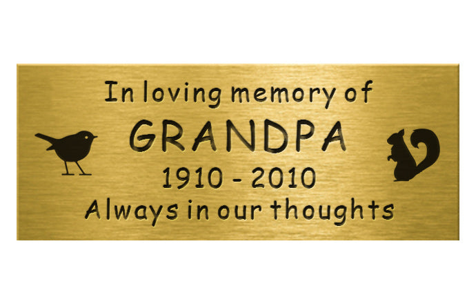 Memorial plaque for Grandpa with engraved text on a gold background