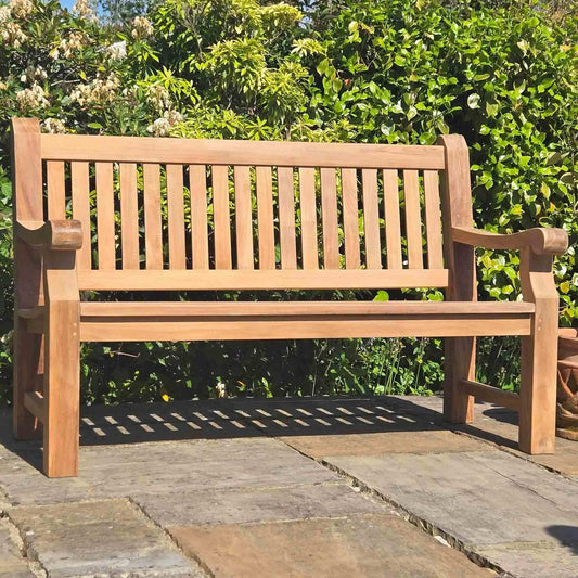 wooden memorial benches on a patio