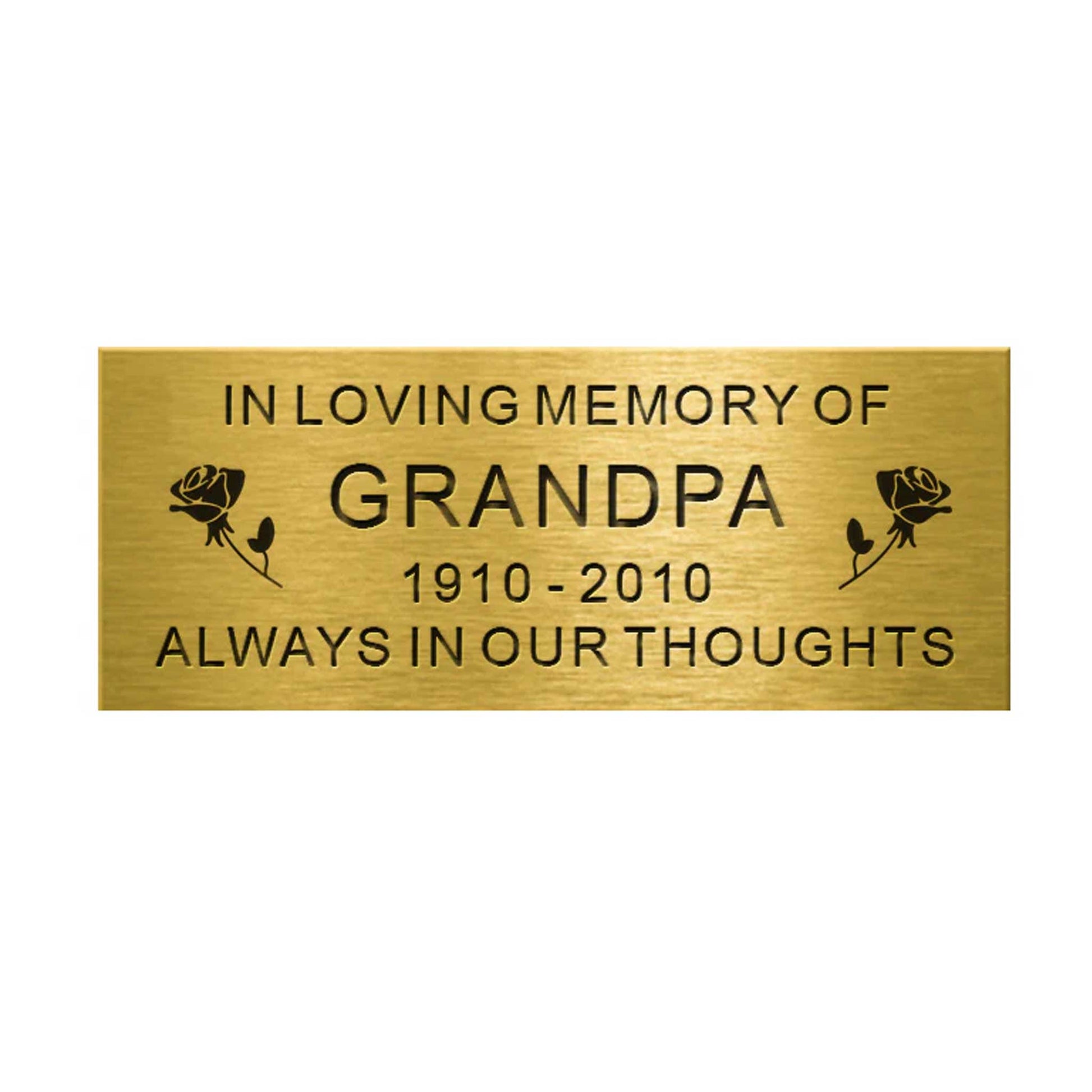 Brass plaque with engraved text 'In Loving Memory of Grandpa 1910-2010 Always in Our Thoughts' on a white background