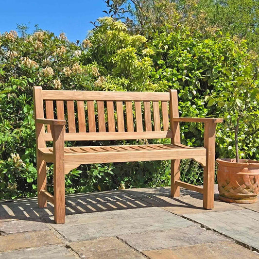 a small memorial bench for garden on a patio