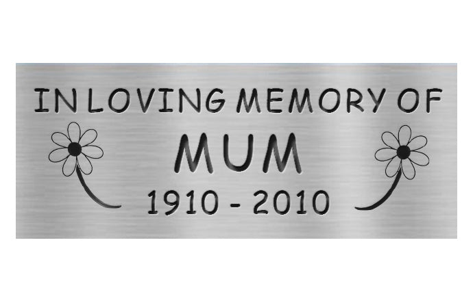 Memorial plaque for 'In Loving Memory of Mum' with daisy designs on a white background