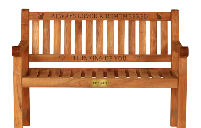 carved words on a wooden memorial bench