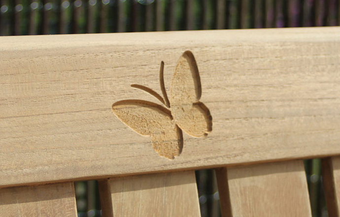 engraved-images-carved-into-wooden-bench