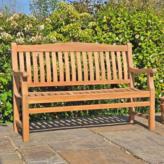 bereavement bench in a garden setting on a patio