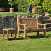 coffee table for outside in a garden setting with greenery