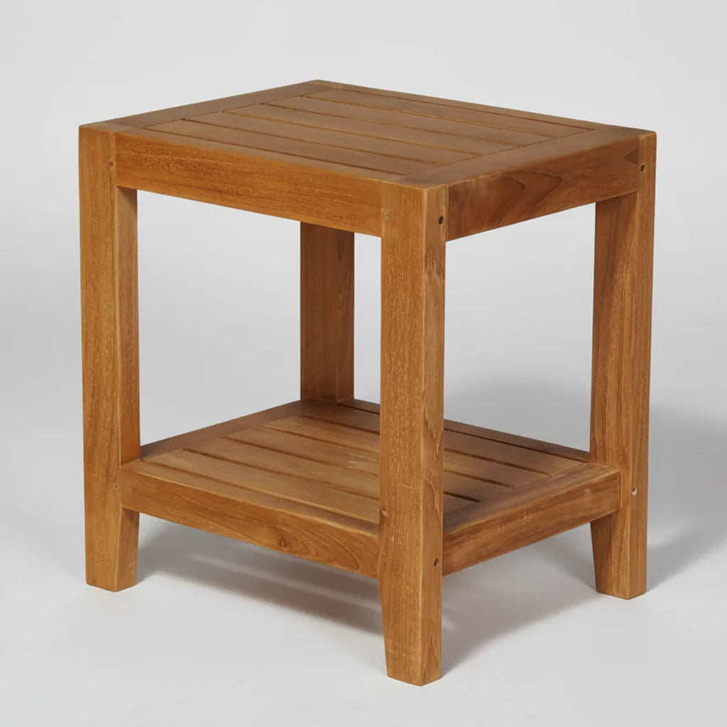 Wooden teak garden side table witha a shelf on a white background