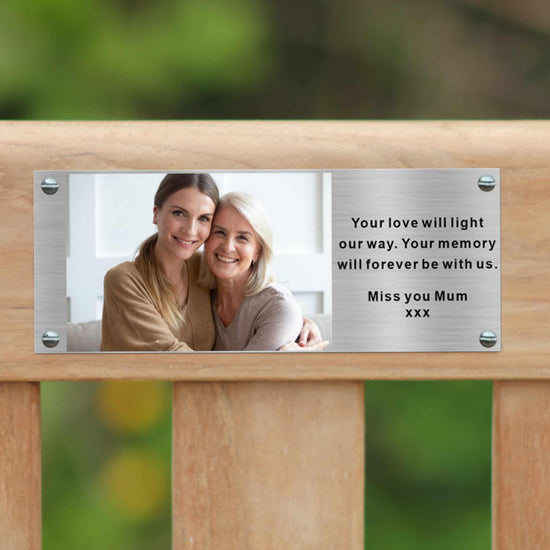 commemorative bench displaying a photo plaque