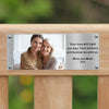 commemorative bench displaying a photo plaque