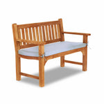 white cushion on a garden bench
