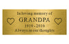 Gold plaque with engraved text 'In loving memory of GRANDPA 1910-2010 Always in our thoughts' on a white background