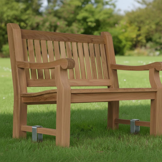 a garden bench anchored in the grass