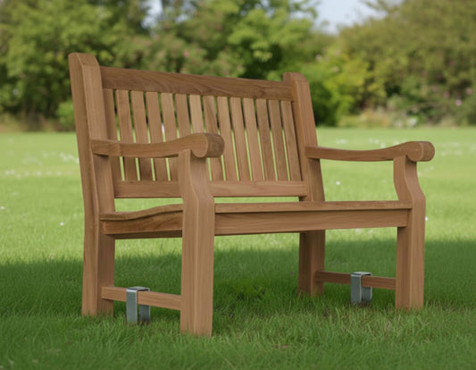 a garden bench anchored in the grass
