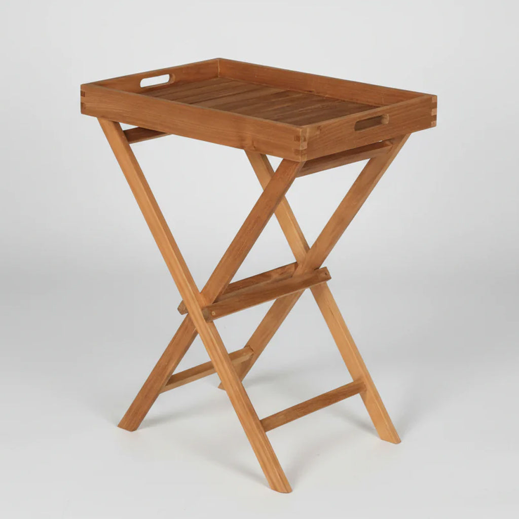 Wooden teak folding tray table and stand on a white background