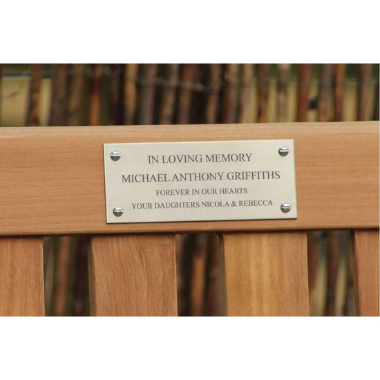a memorial armchair with a stainless steel plaque