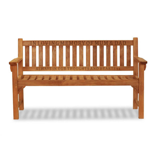 wooden memorial bench with 2 rails of carved text on a white background