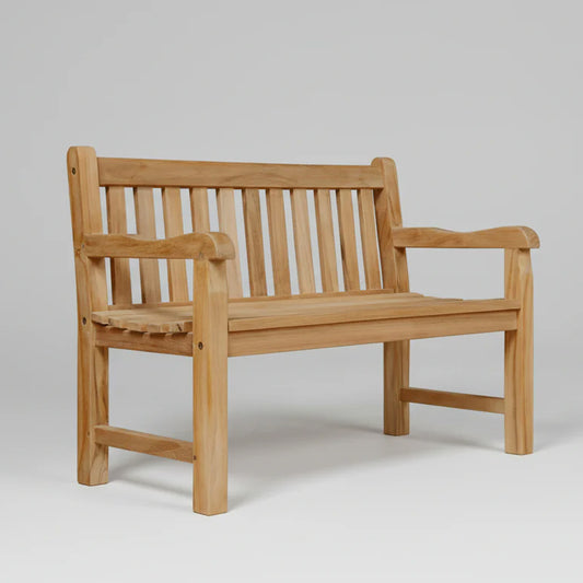 Teak mini sized memorial bench on a plain background
