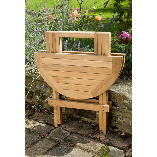 folding outdoor coffee side table in a garden setting