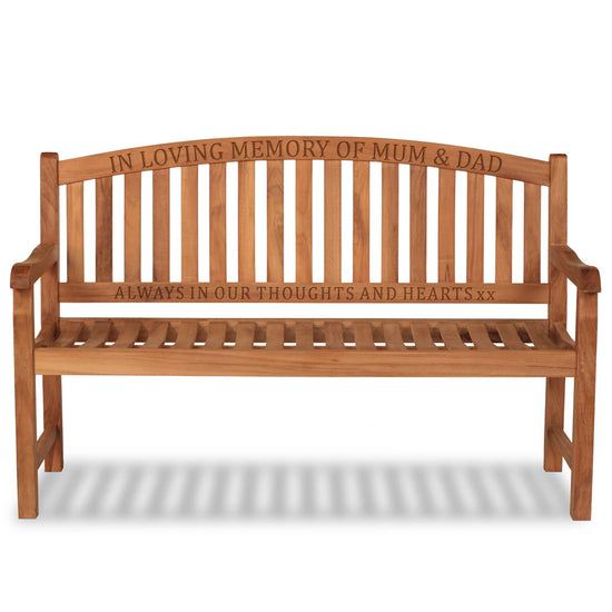 Wooden memorial bench with engraved text on 2 rails on a white background