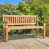 remembrance bench in a garden setting on a patio