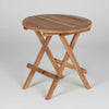 Wooden teak round garden folding table on a white background