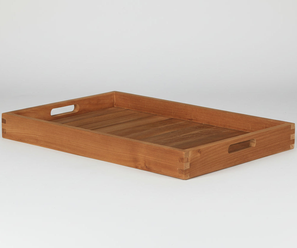 Wooden butlers tray with handles on a white background