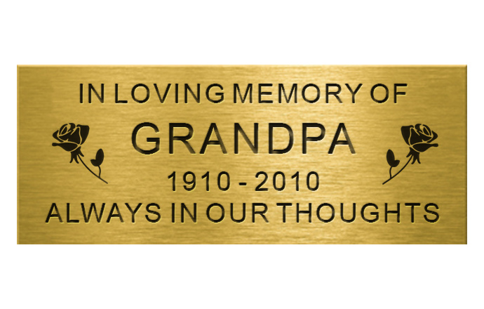 engraved brass plaque with words and rose