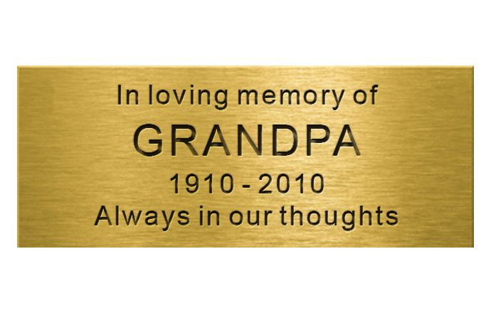 engraved brass plaque with words in arial font