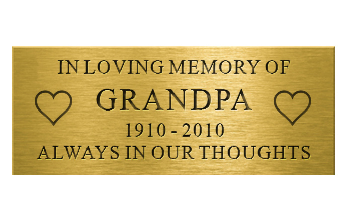 engraved brass plaque with images