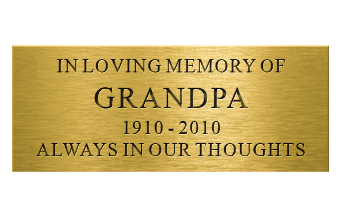 engraved brass plaque with words