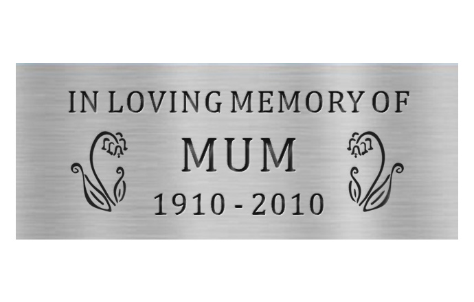 engraved brass plaque with images